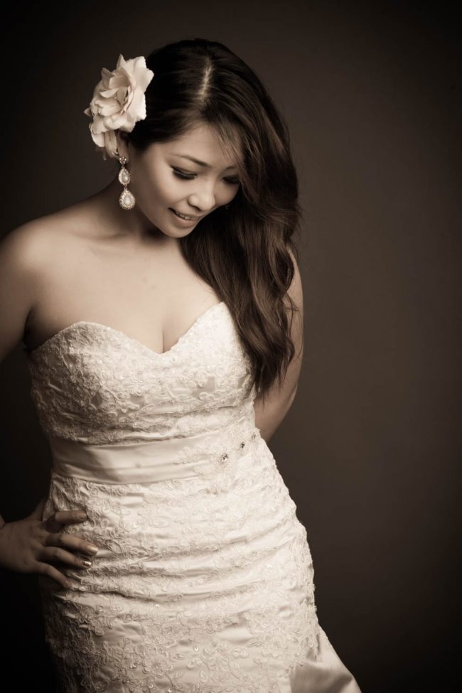 Bridal Photoshoot Singapore bride in wedding dress flower in hair black and white portrait