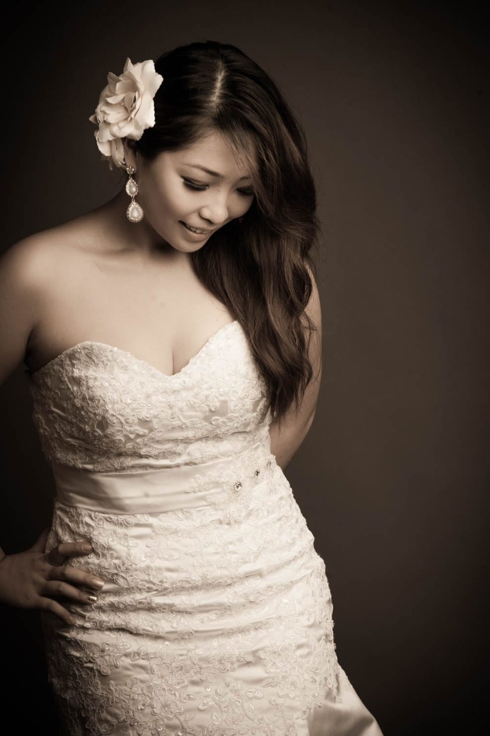 Bridal Photoshoot Singapore bride in wedding dress flower in hair black and white portrait