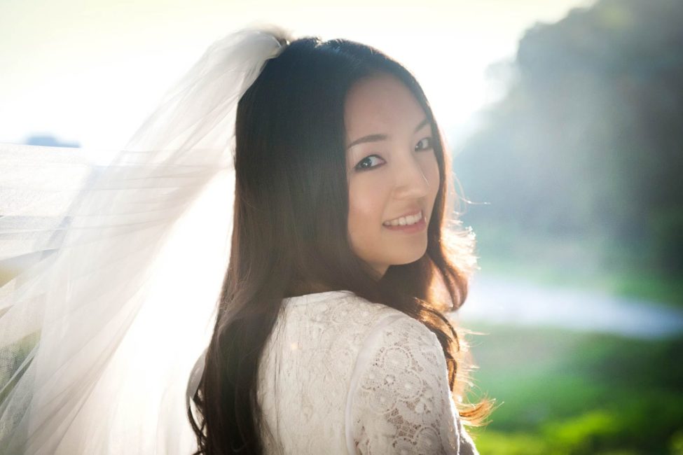 Bridal Photoshoot Singapore bride with veil headshot portrait outdoors nature landscape background
