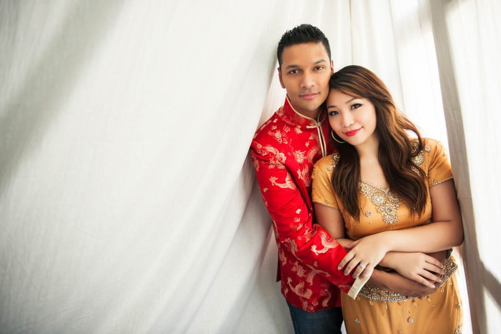 Bridal Photoshoot Singapore groom hugging bride indoor portrait natural light with white cloths