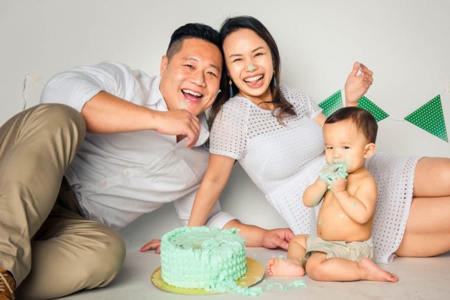 Cake Smash Photography Singapore family fun photoshoot with cake eating toddler young boy and happy parents