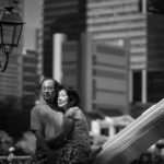 Couple Photography Singapore elderly couple hugging looking at scenery outdoor photoshoot black and white portrait at Singapore River
