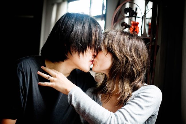 Couple Photography Singapore man and woman kissing indoor photoshoot with natural light