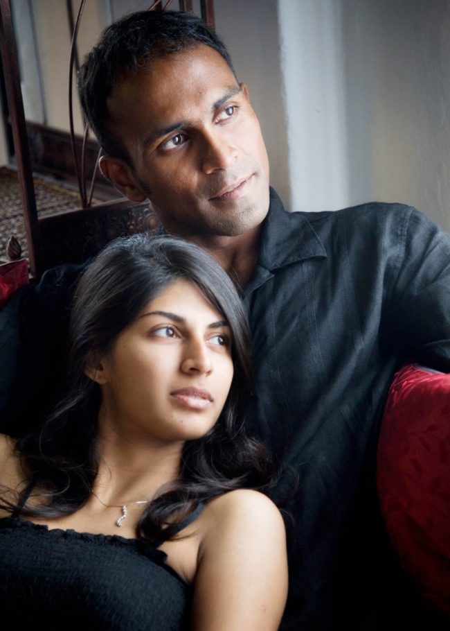 Couple Photography Singapore man and woman couple looking away to the right at indoor photoshoot