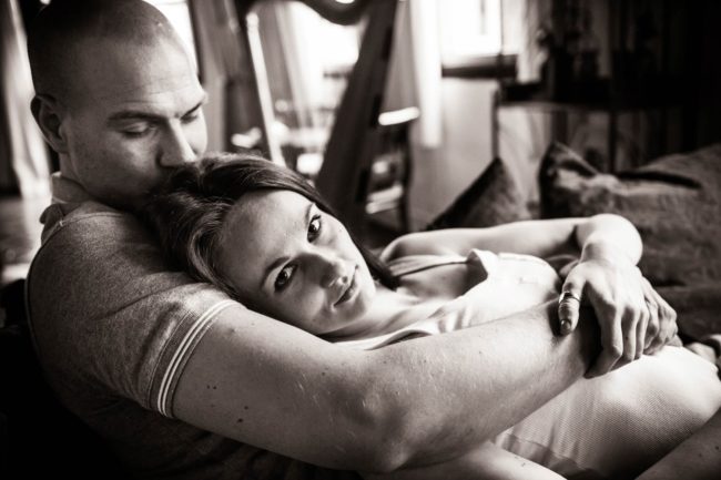 Couple Photoshoot Singapore man and woman cuddling on sofa black and white portrait photography