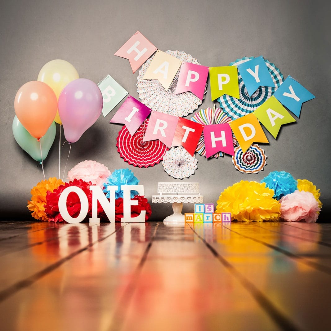 First Year Photography Singapore photoshoot of colourful birthday party decorations flowers signs balloons