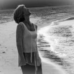 Glamour Photography Singapore outdoor photoshoot smiling woman at the beach black and white portrait photography