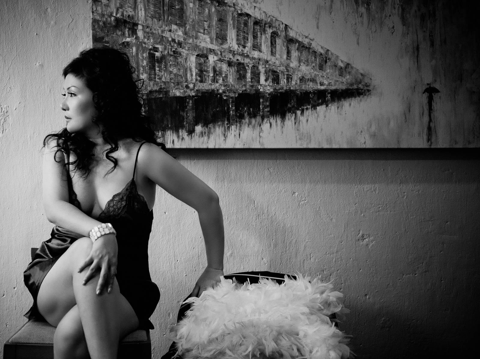 Glamour-Photoshoot-Singapore-intimate-boudoir-woman-sitting-looking-away-black-and-white-portrait  | White Room Studio