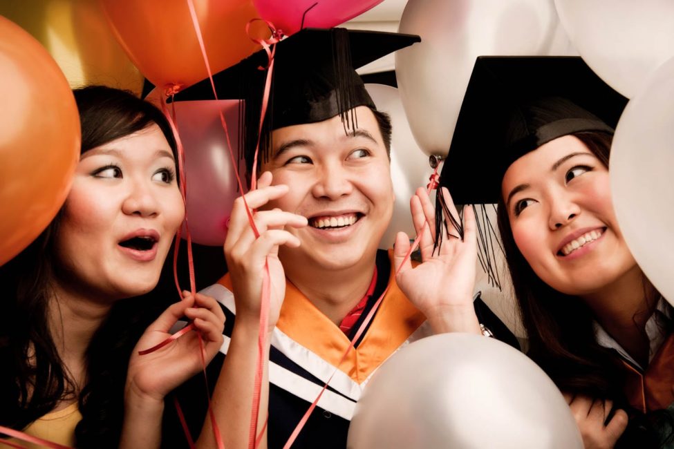 Graduation Photoshoot Package Singapore graduate friends smiling with colourful balloons
