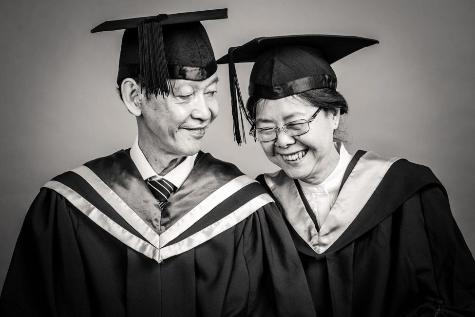 Graduation Pictures Singapore elderly graduate couple smiling black and white portrait photography