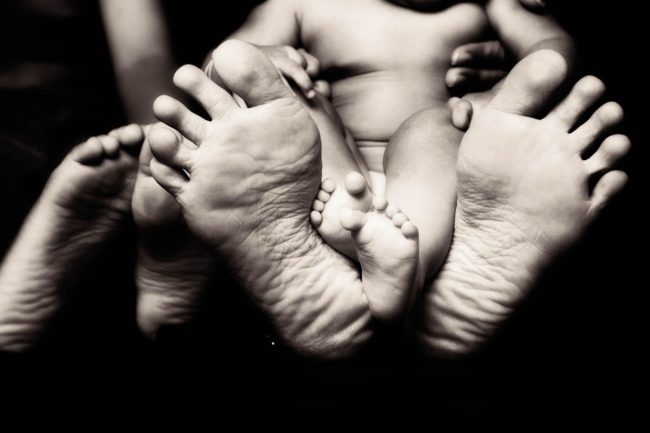 Newborn Photography Singapore baby and parent feet portrait black and white photography