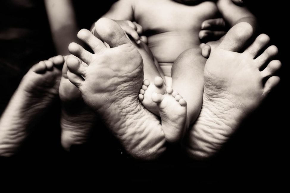 Newborn Photography Singapore baby and parent feet portrait black and white photography