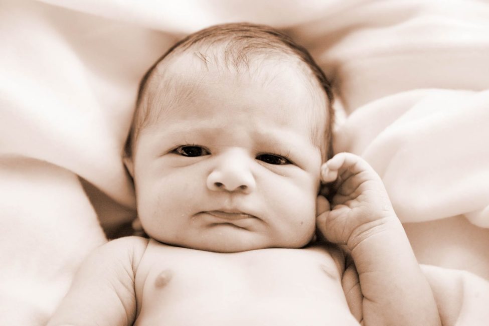 Newborn Photography Singapore baby with eyes opened portrait black and white photography