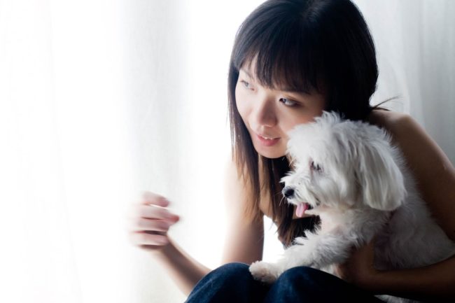 Pet Photography Singapore woman pet owner holding white maltese