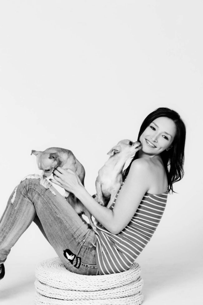 Pet Portrait Photography Singapore woman sitting and carrying 2 chihuahuas black and white portrait photography