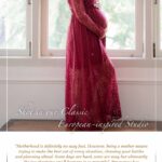 Pregnant mother smiling and standing against tall windows natural light during a professional Maternity photoshoot in Singapore Credit: White Room Studio