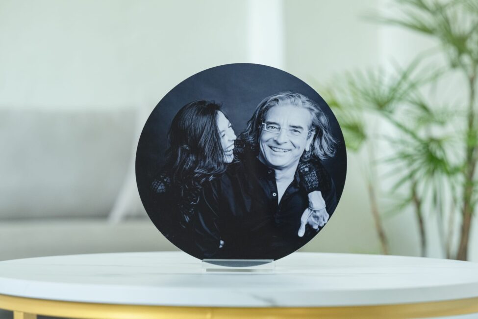 Metal print of husband and wife in a photography studio setting during a couple photoshoot in Singapore, White Room Studio. Credit: White Room Studio Pte Ltd