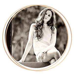 Glamour Photography woman sitting on ledge with white dress