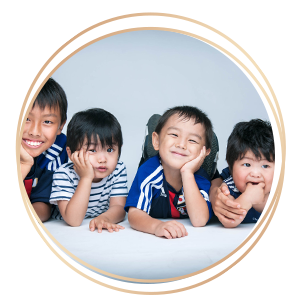 Children Kids Photography 4 children heads resting on hands and smiling