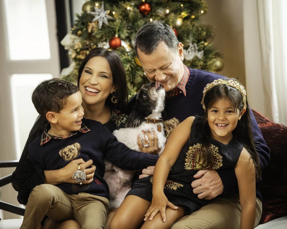 Family photoshoot package singapore Christmas decorations and setting of happy family candid photo with pet dog