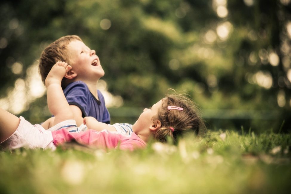 Children Singapore Photoshoot Outdoor boy and girl siblings playing in grass patch
