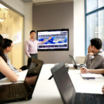 Group of Professionals in a office meeting taken in a corporate office room with computers Credit: White Room Studio