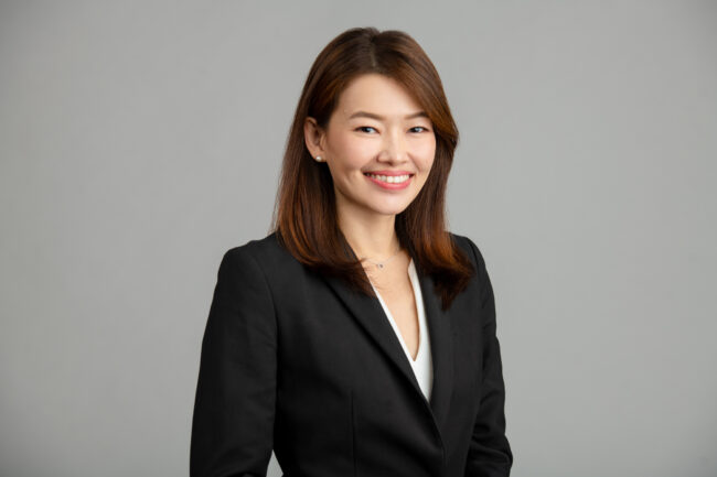 Professional_headshots_00 Asian woman in a formal corporate attire smiling for her headshot