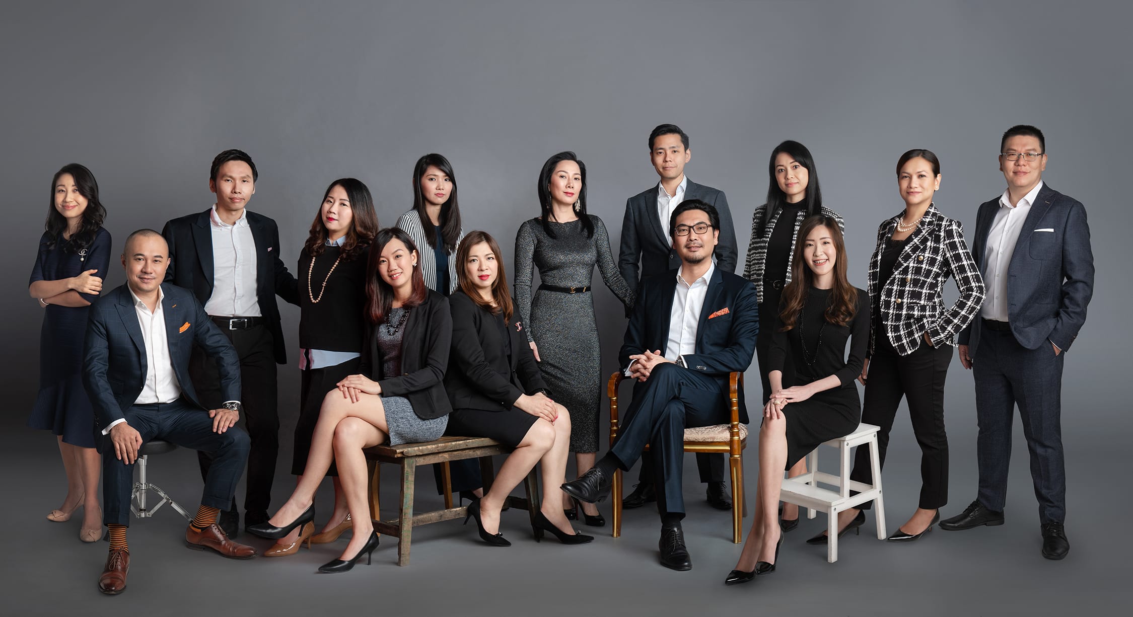 A group of male and female professionals posing for a corporate photoshoo in Singapore, White Room Studio Credit: White Room Studio