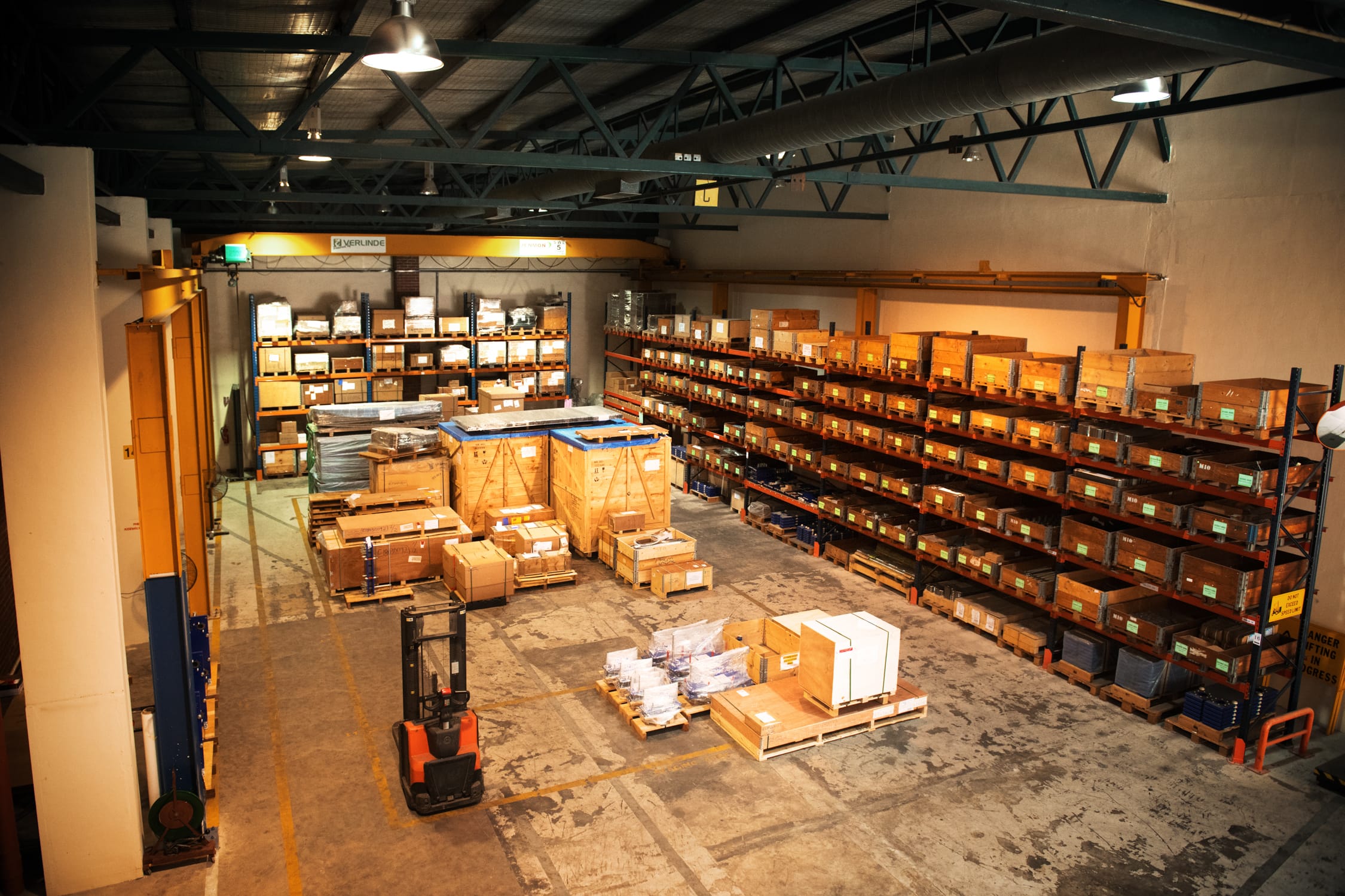 Wide shot of a logistics warehouse packed with goods