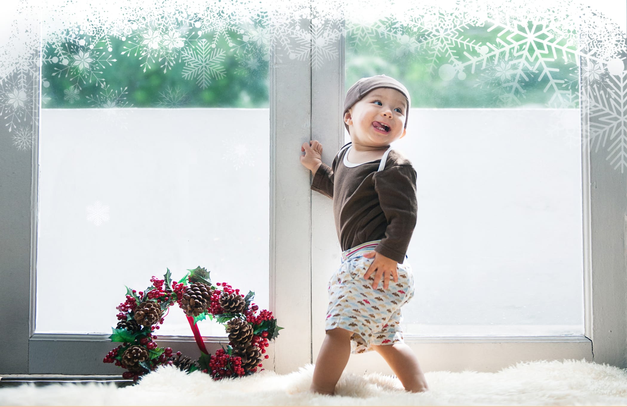 Kid smiling candid during family Christmas photoshoot in Singapore Credit: White Room Studio