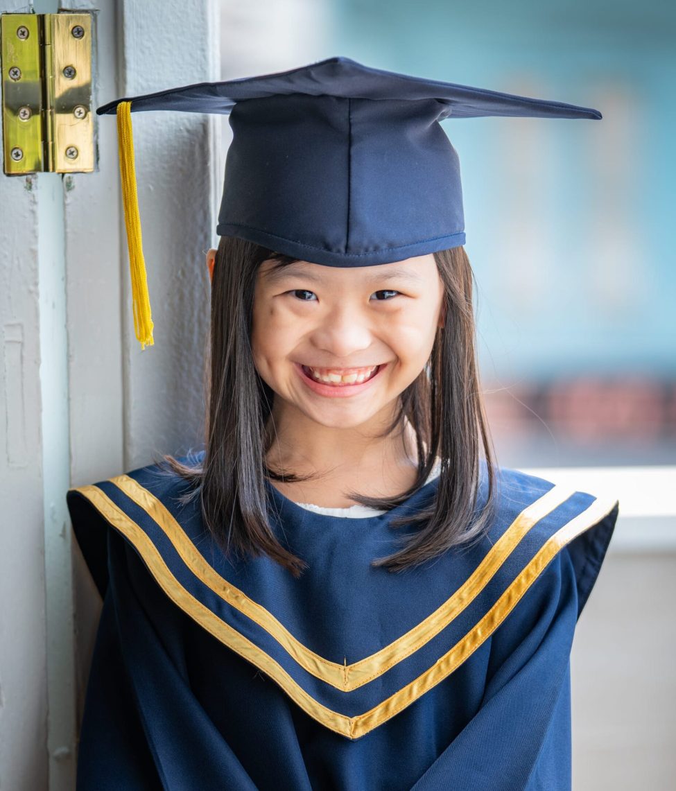 Girl in K2 kindergarten graduation gown and cap during a k2 kindergarten graduation photoshoot in Singapore Credit: White Room Studio