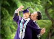 Smiling Father and daughter in K2 kindergarten graduation gown and cap with nature scenery background during a kindergarten graduation k2 photoshoot in Singapore Credit: White Room Studio