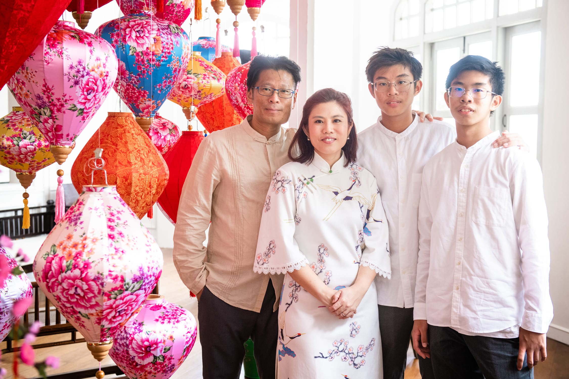 Professional Family & Multi Generation Photoshoot in Photography Studio, Singapore Family with parents and their children with kids ages to teens in a photography studio setting during a Chinese New Year family photoshoot in Singapore, White Room Studio. Credit: White Room Studio Pte Ltd