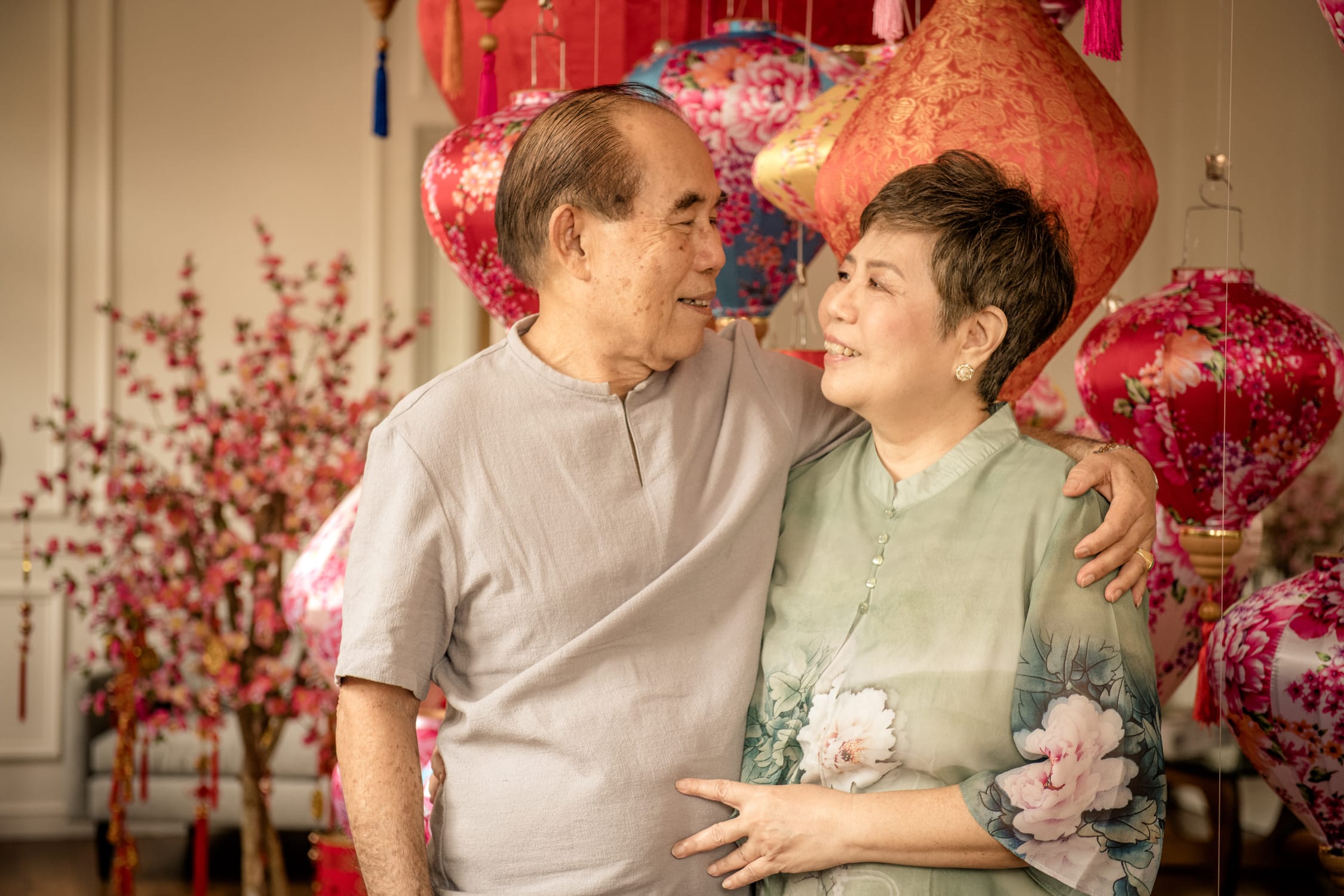 Professional Family & Multi Generation Photoshoot in Photography Studio, Singapore Grandfather and grandmother (grandparents) in a photography studio setting during a Chinese New Year family photoshoot in Singapore, White Room Studio. Credit: White Room Studio Pte Ltd