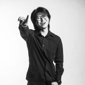 Professional headshot of a professional photographer in a photography studio setting during a corporate photoshoot in Singapore, White Room Studio. Credit: White Room Studio Pte Ltd