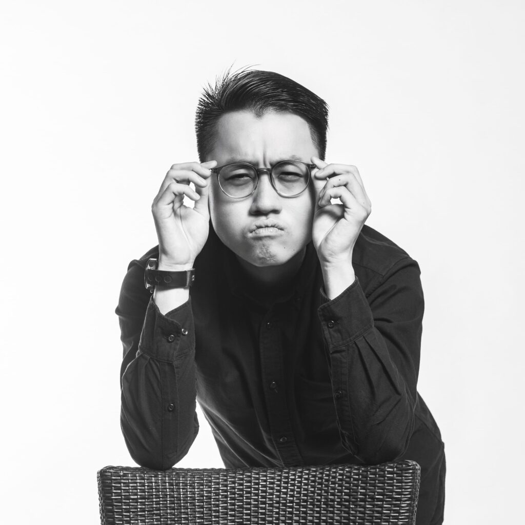 Professional Corporate & Company Photoshoot in Photography Studio, Singapore Professional headshot of a professional photographer in a photography studio setting during a corporate photoshoot in Singapore, White Room Studio. Credit: White Room Studio Pte Ltd