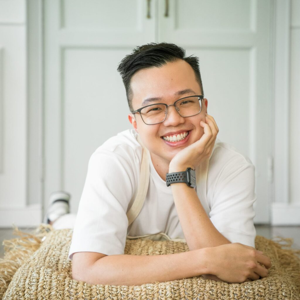 Professional Family Photographer in White Room Studio, Singapore Portrait of a professional photographer in a photography studio setting during a personal portrait photoshoot in Singapore, White Room Studio. Credit: White Room Studio Pte Ltd