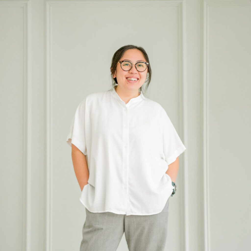 Professional Family Photographer in White Room Studio, Singapore Portrait of a professional photographer in a photography studio setting during a personal portrait photoshoot in Singapore, White Room Studio. Credit: White Room Studio Pte Ltd