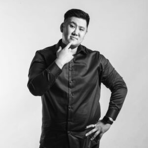 Professional headshot of a professional photographer in a photography studio setting during a corporate photoshoot in Singapore, White Room Studio. Credit: White Room Studio Pte Ltd