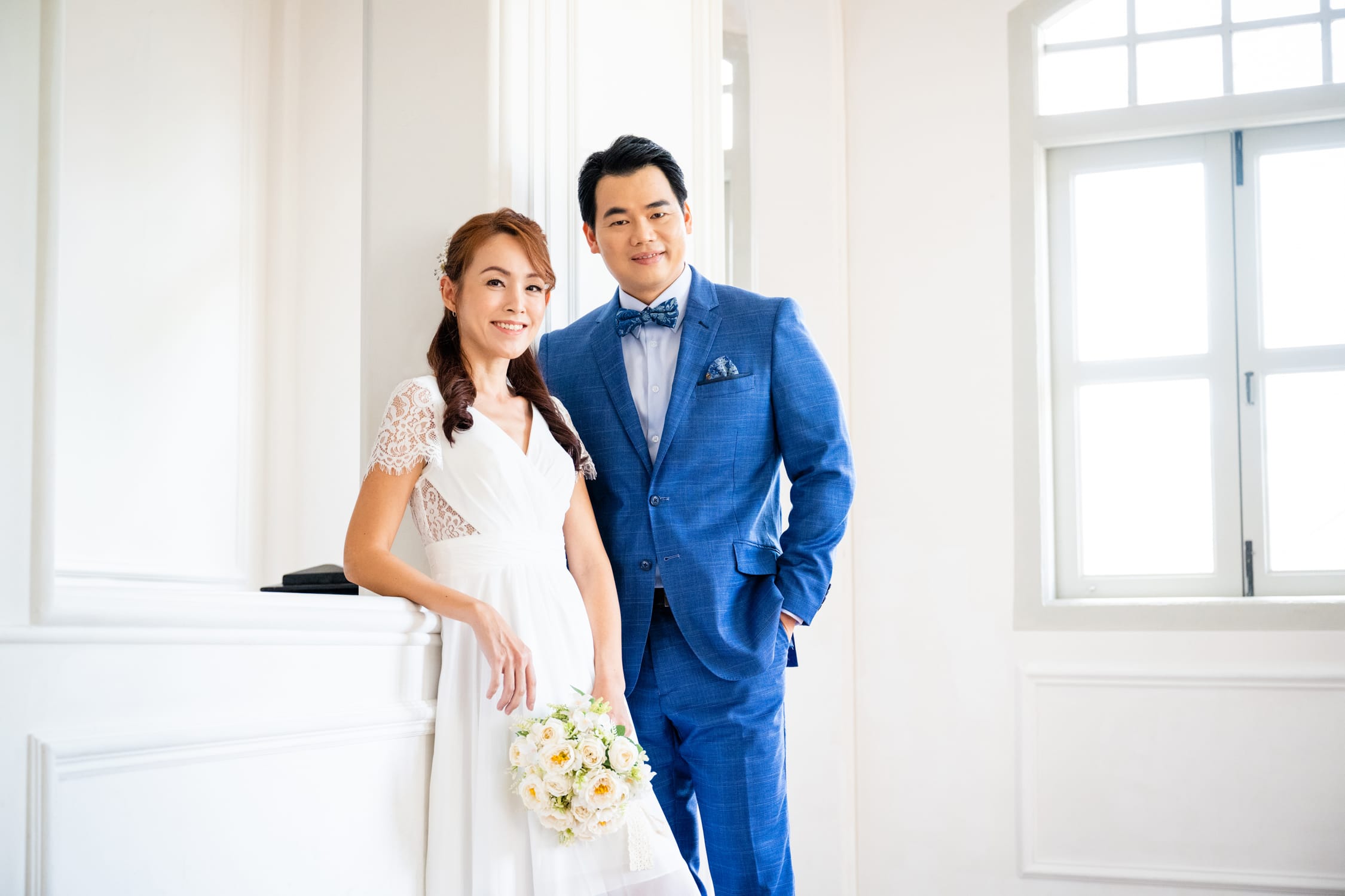Mother and father, engaged boyfriend and girlfriend, fiance and fiancee in a photography studio setting during a pre-wedding photoshoot in Singapore, White Room Studio. Credit: White Room Studio Pte Ltd