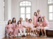 Multi generation family with parents and their children with kids ages ranging from toddler to teens in a photography studio setting during a multi generation family photoshoot in Singapore, White Room Studio. Credit: White Room Studio Pte Ltd