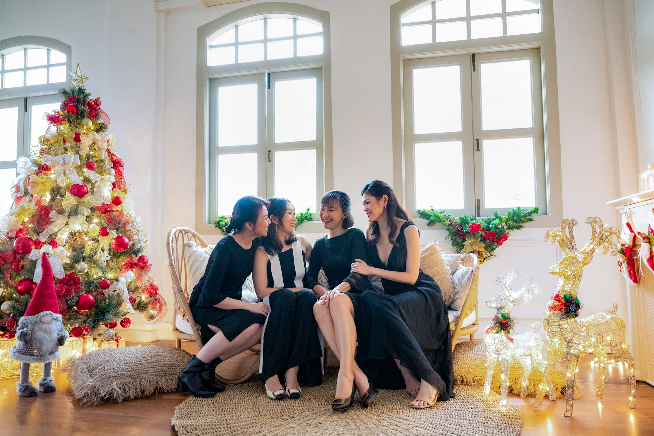 Best friends in a photography studio setting during a Christmas family photoshoot in Singapore, White Room Studio. Credit: White Room Studio Pte Ltd