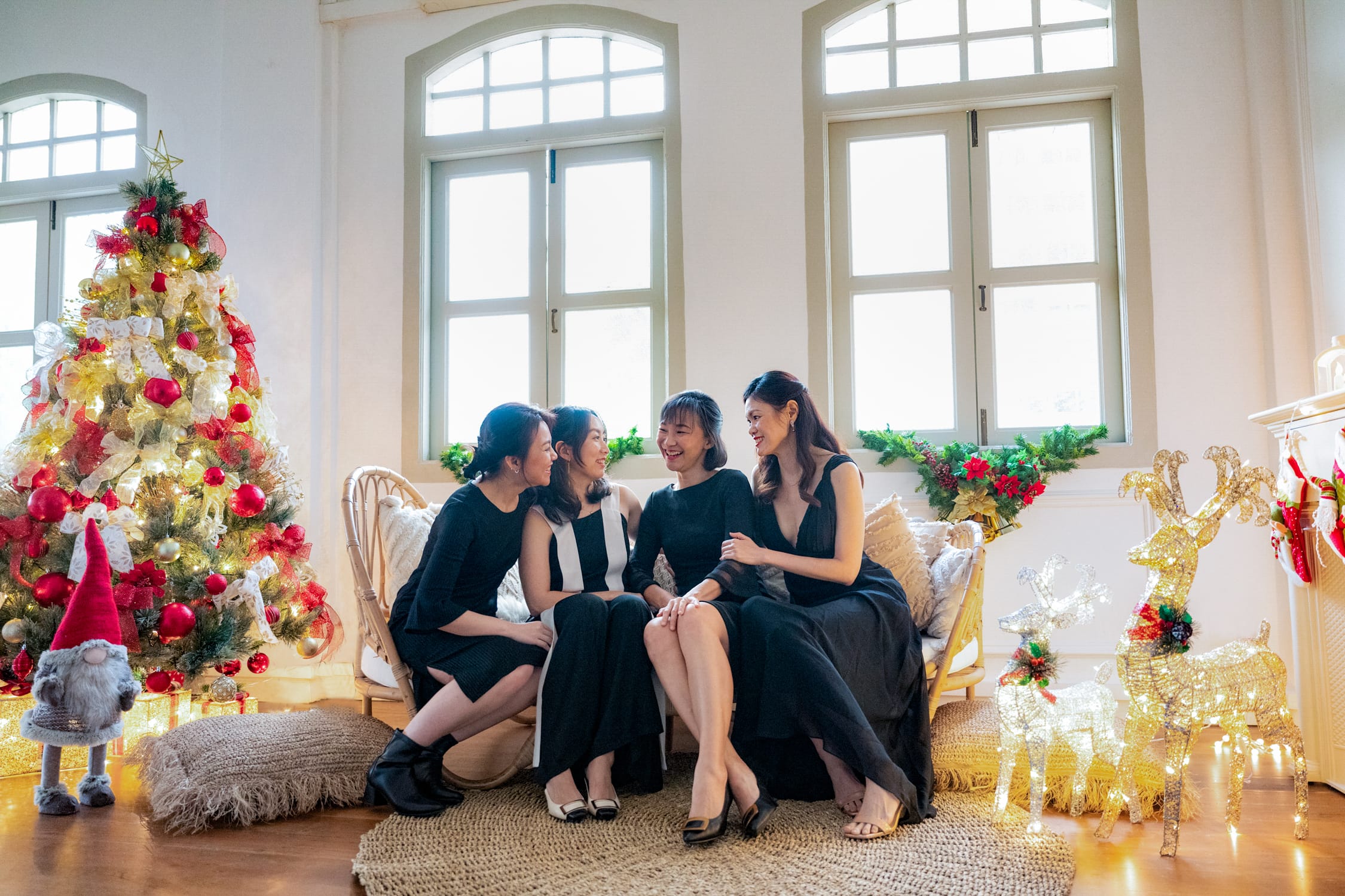 Professional Christmas Family Photoshoot in Photography Studio, Singapore Best friends in a photography studio setting during a Christmas family photoshoot in Singapore, White Room Studio. Credit: White Room Studio Pte Ltd