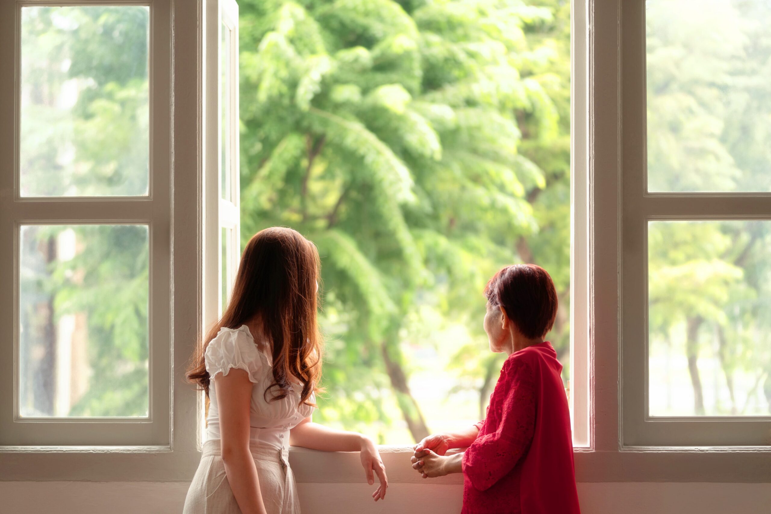 Family with mother and daughter in a photography studio setting during a family photoshoot in Singapore, White Room Studio. Credit: White Room Studio Pte Ltd