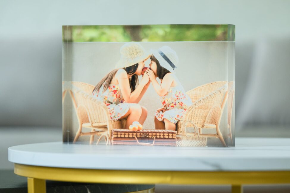 Acrylic table art block of a family with kids in a photography studio setting during a family photoshoot in Singapore, White Room Studio. Credit: White Room Studio Pte Ltd