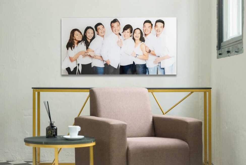 Crystal mount print of a family with parents and their children with kids in a photography studio setting during a family photoshoot in Singapore, White Room Studio. Credit: White Room Studio Pte Ltd