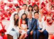 Family with parents and their children with kids ages ranging from teens to adults in a photography studio setting during a family Chinese New Year photoshoot in Singapore, White Room Studio. Credit: White Room Studio Pte Ltd