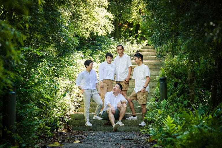 Family with parents and their children in an outdoor setting during an outdoor family photoshoot in Singapore, Gardens by the Bay. Credit: White Room Studio Pte Ltd