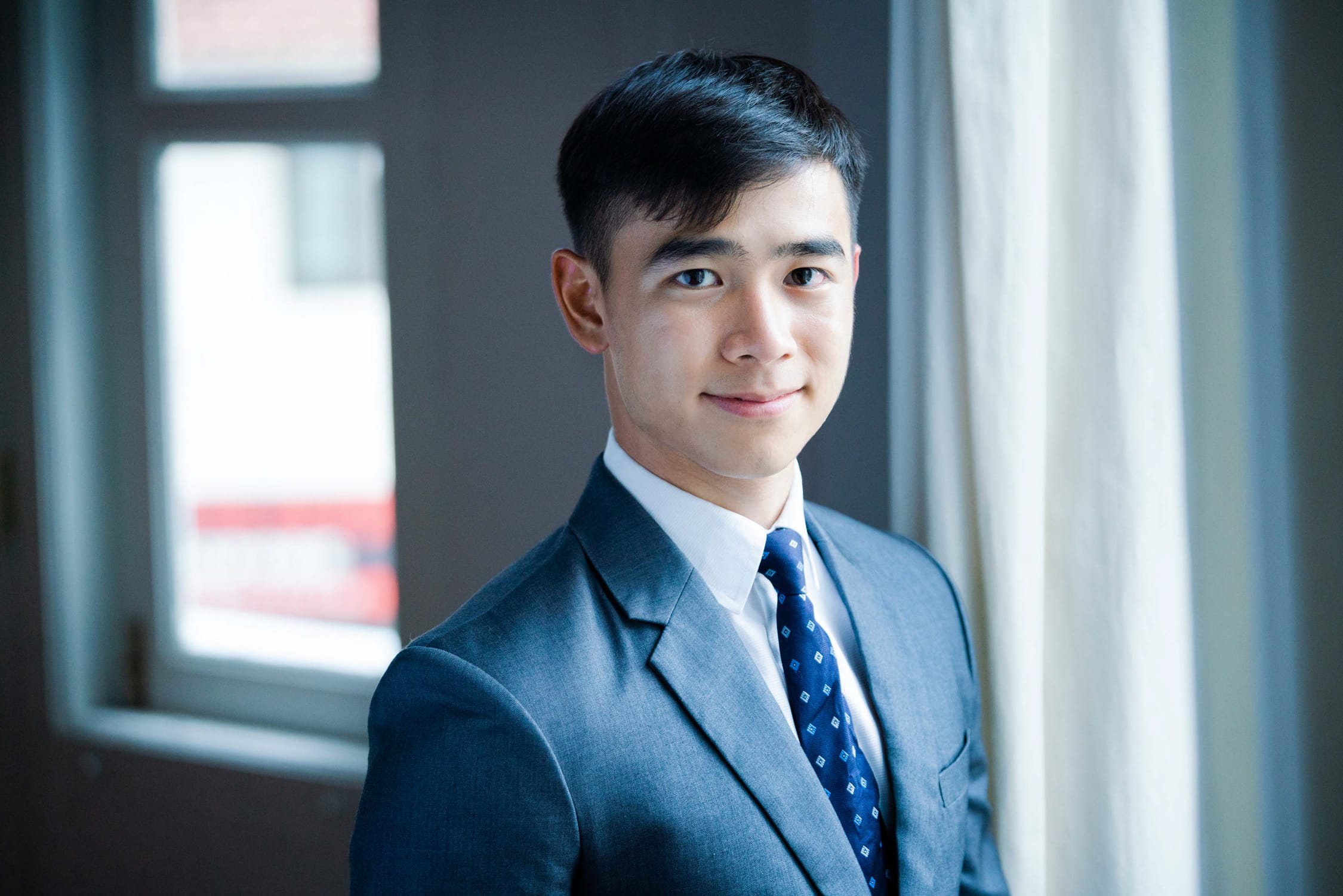 Professional Corporate & Company Photoshoot in Photography Studio, Singapore Corporate professional in a photography studio setting during a corporate photoshoot in Singapore, White Room Studio. Credit: White Room Studio Pte Ltd