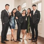 Family with parents and their children with kids ages ranging from toddler to teens in a photography studio setting during a family photoshoot in Singapore, White Room Studio. Credit: White Room Studio Pte Ltd